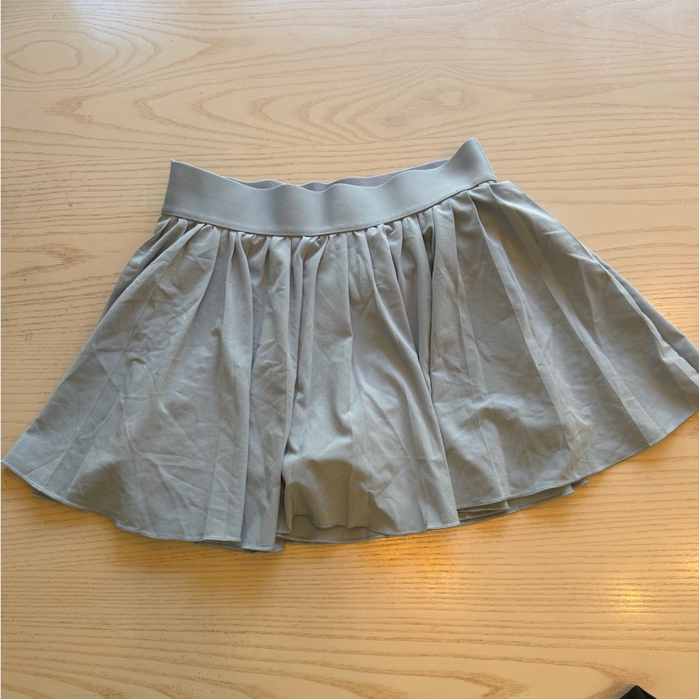 Woman’s tennis skirt TNA.Cute light blue color with pleats/built in skort. Small
